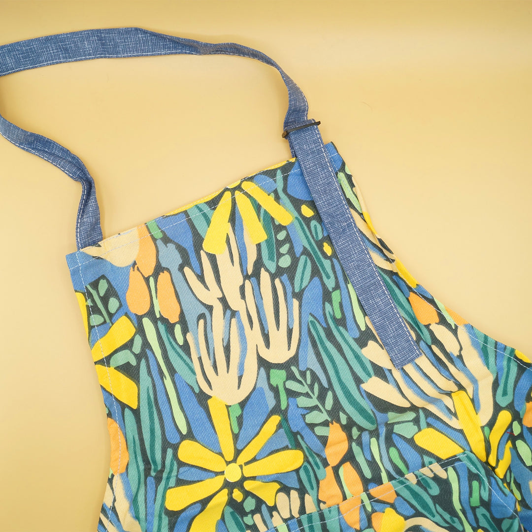 a yellow, blue, and orange kitchen apron