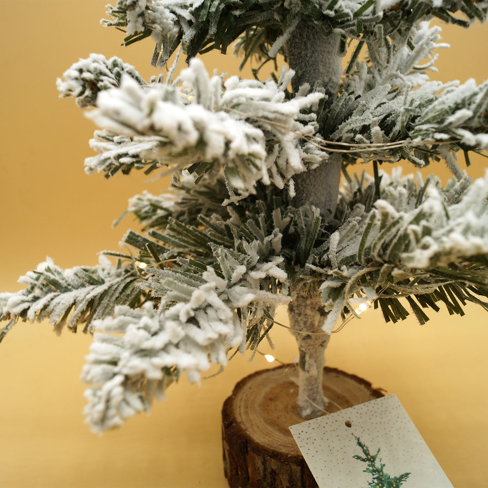 A close up of the miniature Christmas tree to show the flocking and the light strands.