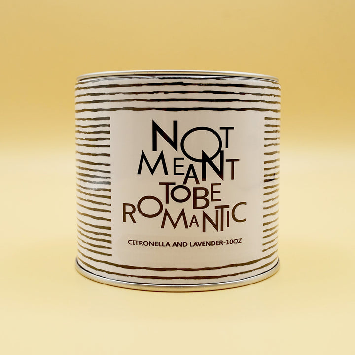 a black and white striped candle with the label Not Meant to be Romantic - citronella and lavender - 10oz