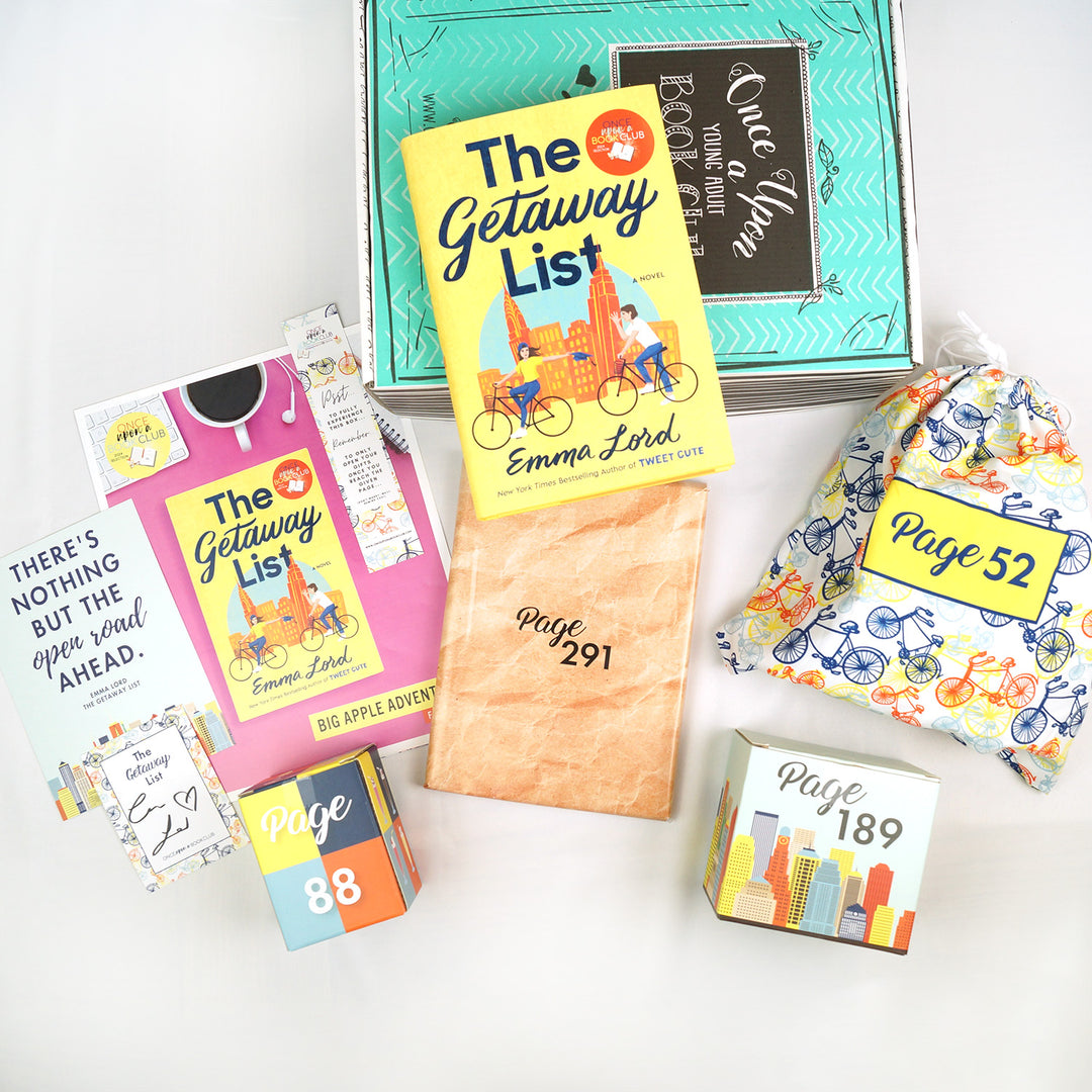 A hardcover copy of The Getaway List by Emma Lord sits on a green Once Upon a Book Club Young Adult box. Surrounding that are four wrapped gifts labeled with page numbers plus a signed bookplate, quote print, bookmark, and book club kit.