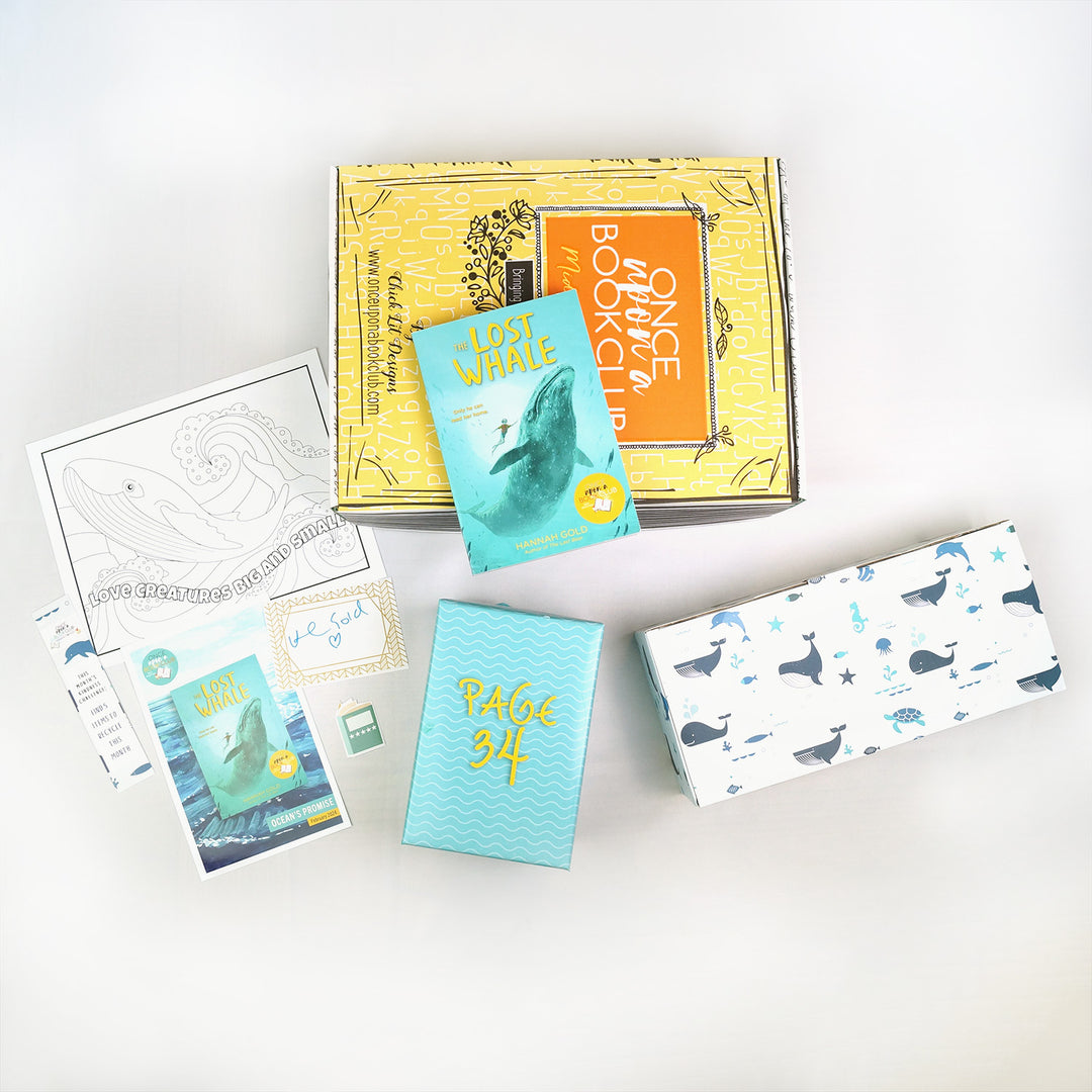 A paperback copy of The Lost Whale by Hannah Gold sits on a yellow Once Upon a Book Club middle grade box. Surrounding this are two wrapped gifts labeled with page numbers, a signed bookplate, custom bookmark, sticker, coloring sheet, and reading flyer.