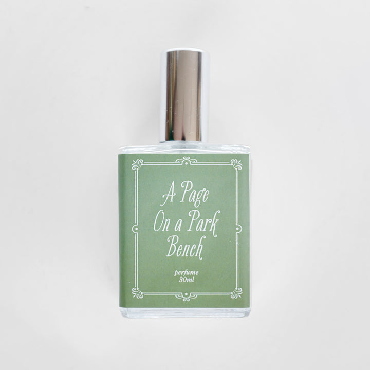 A closeup of the bottle containing the fragrance "A Page on a Park Bench".