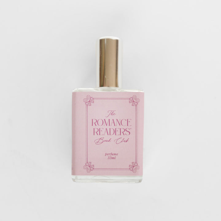 A closeup of the bottle containing the fragrance "The Romance Readers' Book Club".