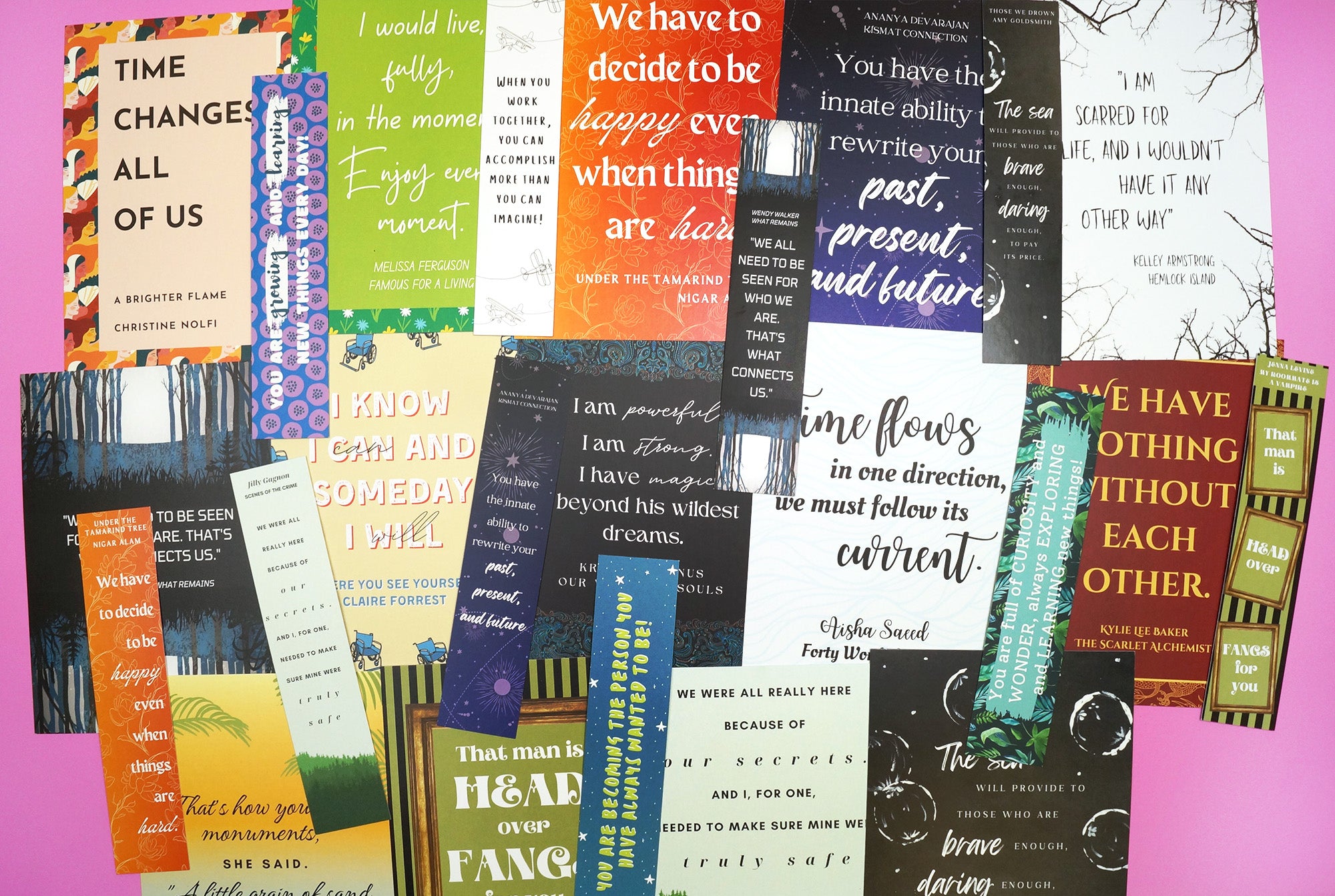 a pile of a variety of quote cards and bookmarks is across the entire image, overlapping eachother