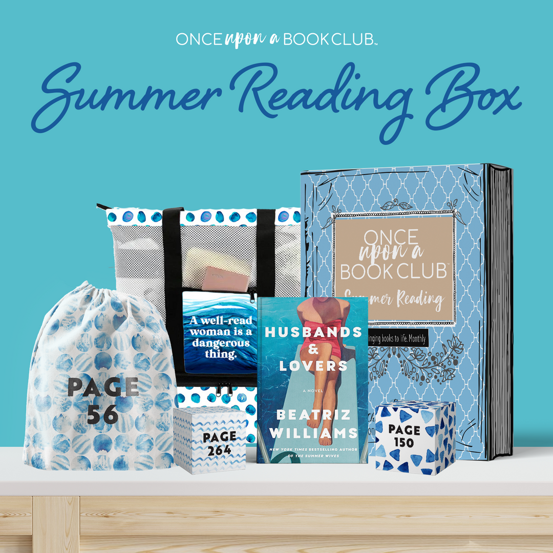 A bright blue background. The words "Once Upon a Book Club Summer Reading Box" are written at the top. On a wooden table is a copy of Husbands & Lovers by Beatriz Williams, three blue and white wrapped gifts labeled with page numbers (Page 56, Page 150, Page 264), a custom designed tote bag featuring a blue polkadot pattern on a white background and the front pocket in a wave pattern printed with the words "A well-read woman is a dangerous thing" and a blue and beige OUABC Book Box.