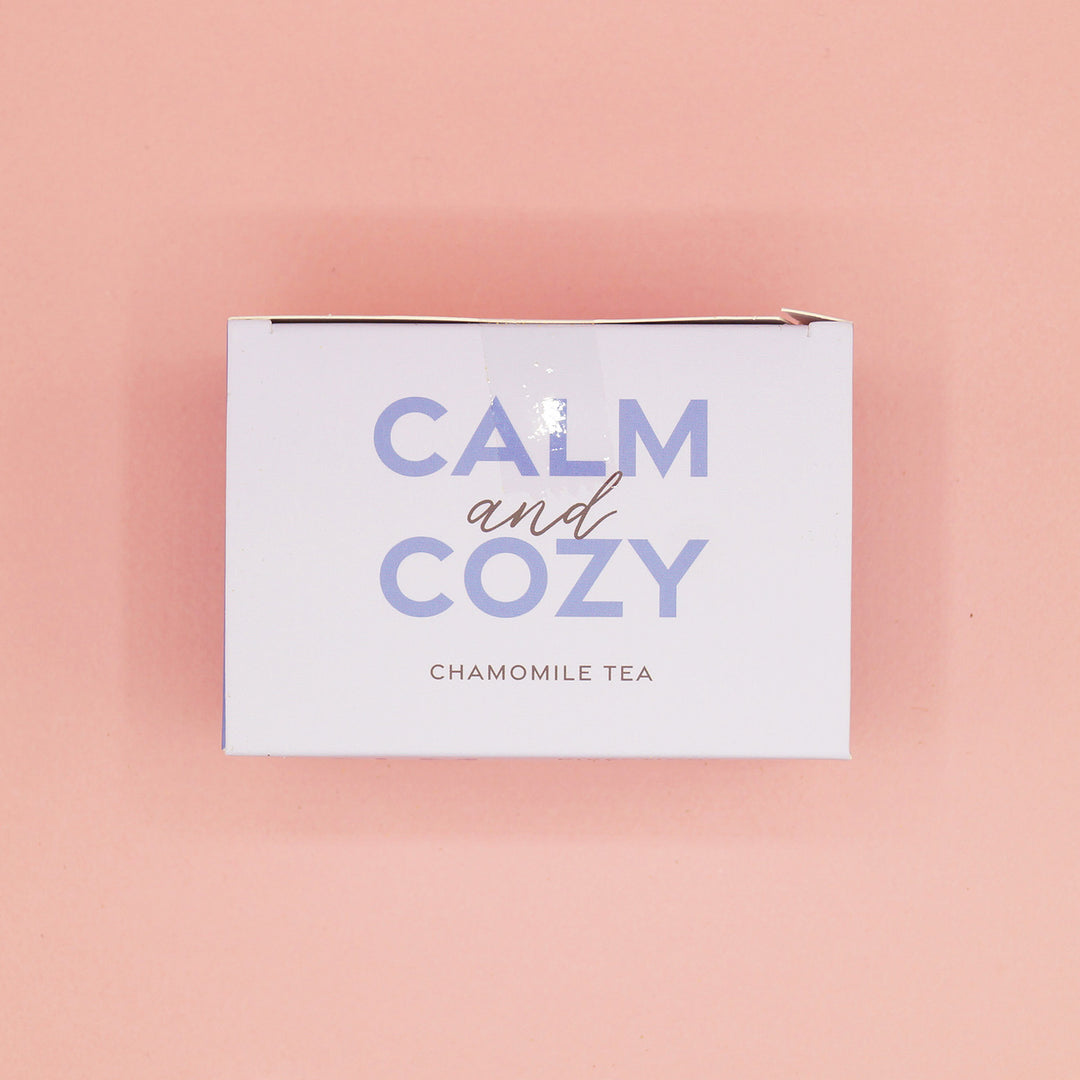 A light purple box labeled Calm and Cozy Chamomile Tea