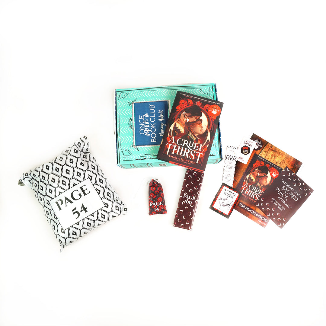 A hardcover edition of A Cruel Thirst lays on a green OUABC box. Also included with the box and book are three themed wrapped gifts labeled with page numbers and paper items.