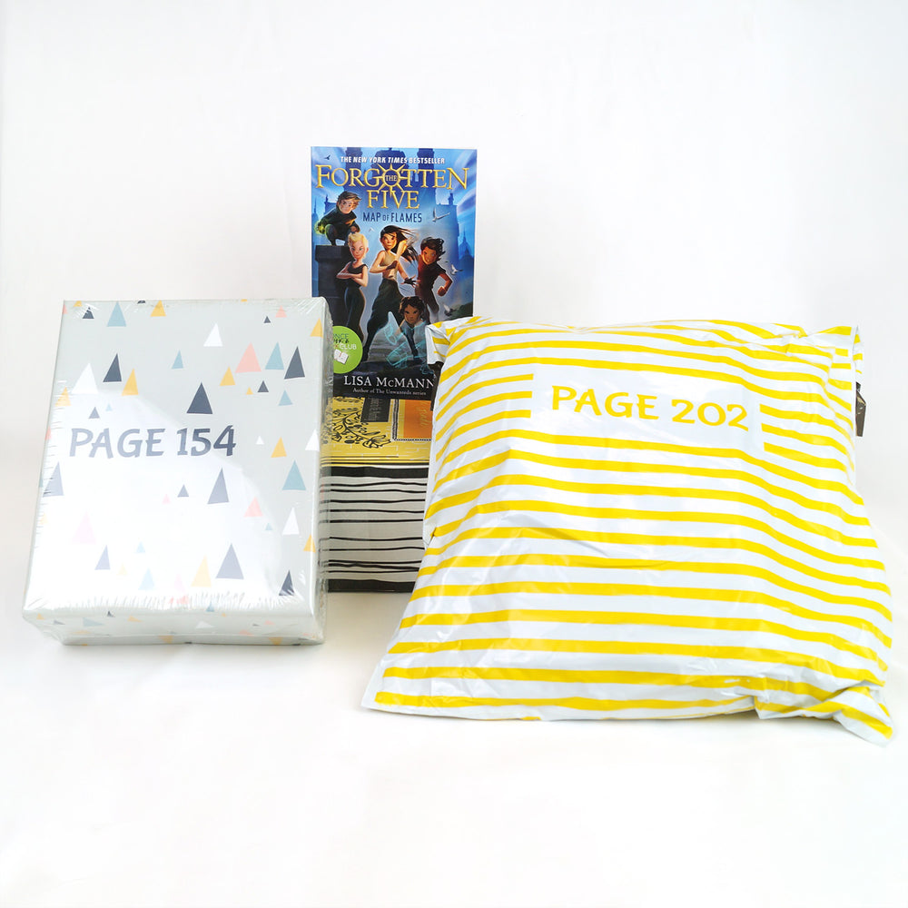 a paperback edition of The Forgotten Five is on top of a yellow Once Upon a Book Club box. In front of the box are a light blue box and yellow and white striped poly bag. The box and bag are labeled with page numbers.
