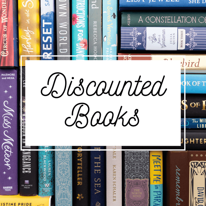 Numerous books lined up in different directions with text “Discounted Books” centered on top.