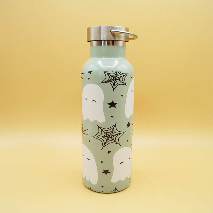 Green water bottle with ghost, spiderwebs, stars, and stainless steel lid on yellow background.