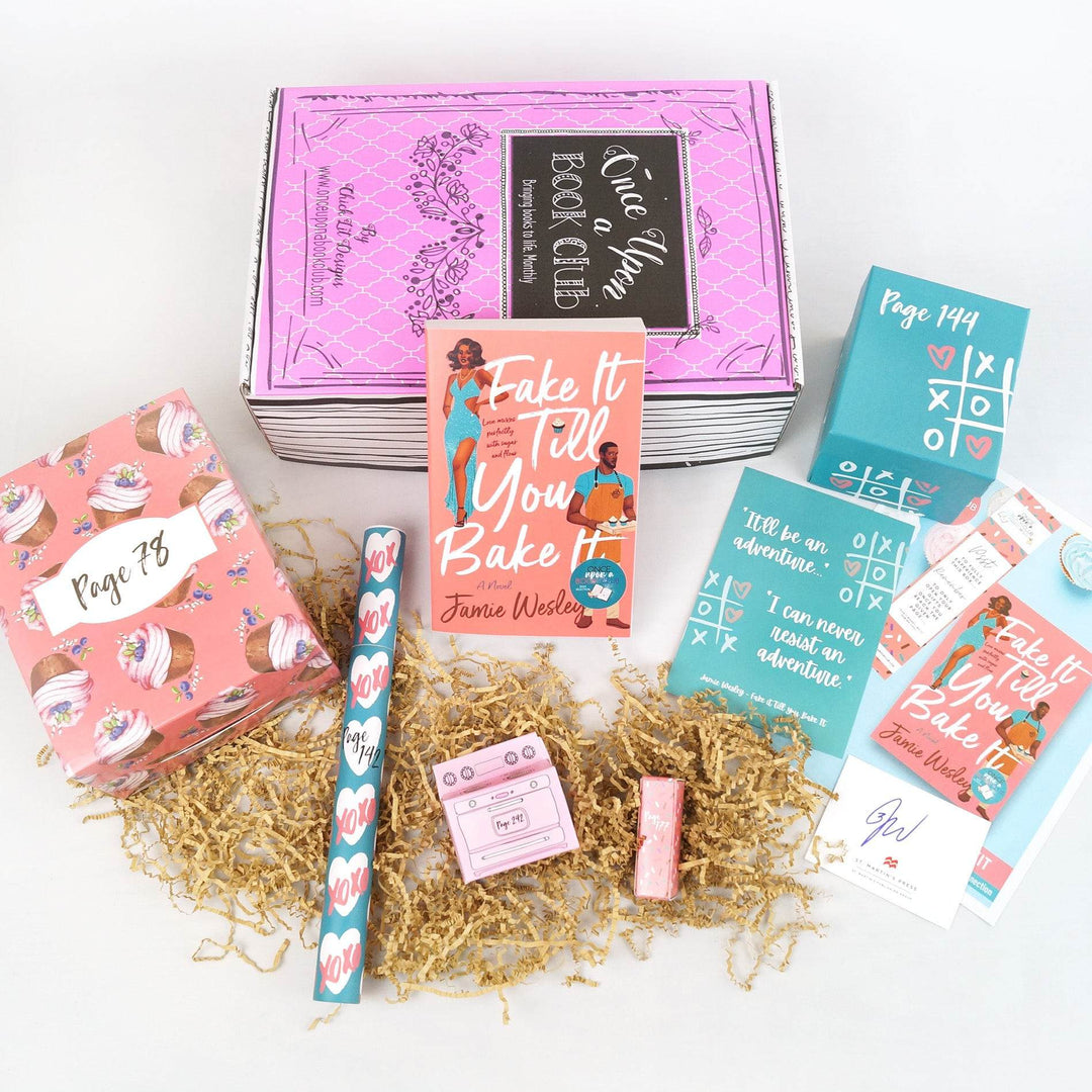 A paperback edition of Fake It Till You Bake It leans against a pink Once Upon a Book Club box. Below it are a pink box with cupcakes on it, a blue tube with white hearts, a pink oven-shaped box, pink lipstick tube, quote card, blue box, bookclub kit, and signature card. The boxes are all labeled with page numbers.