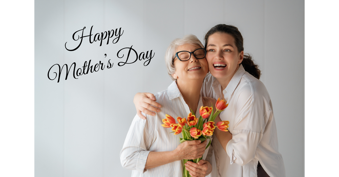 A smiling older woman and her daughter hugging, holding a bouquet of tulips, with “Happy Mother’s Day” text beside them.