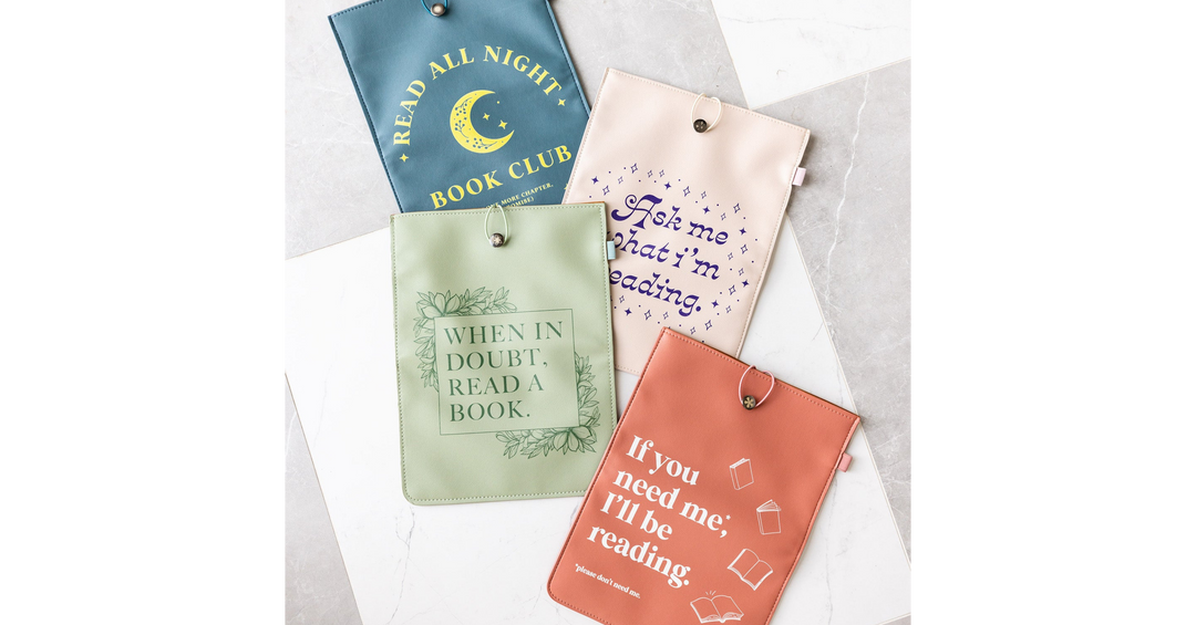 Pastel book sleeves with literary quotes and moon design, arranged flat to showcase different colors and reading-themed messages.