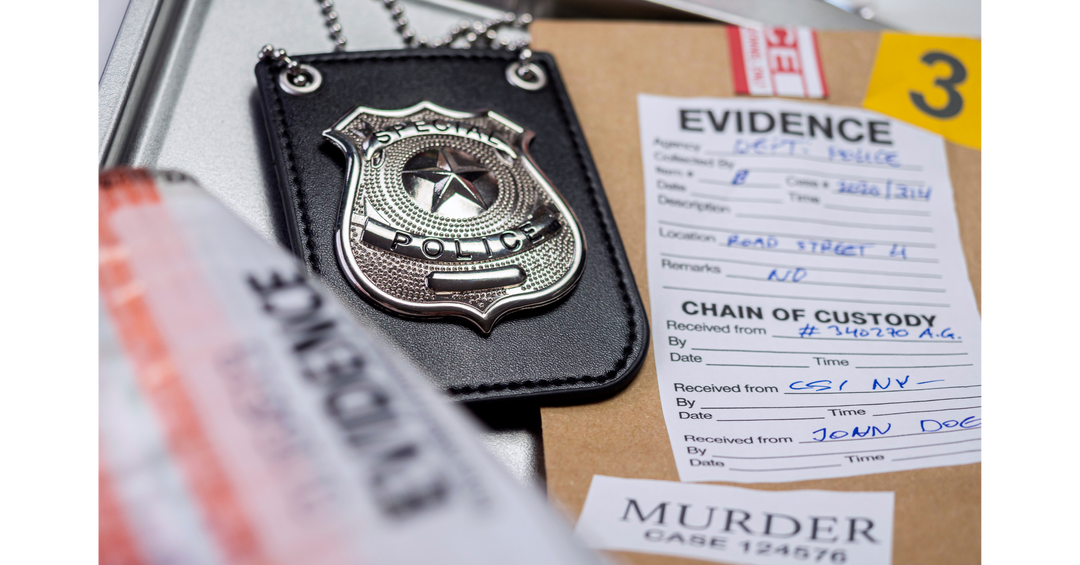 Detective badge and crime scene evidence cards arranged on a desk, representing mystery and thriller investigations.