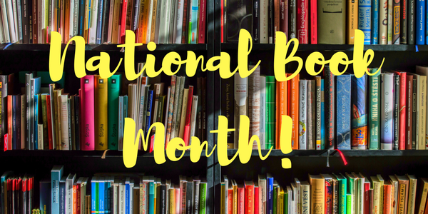 National Book Month' is written in front of shelves of books.