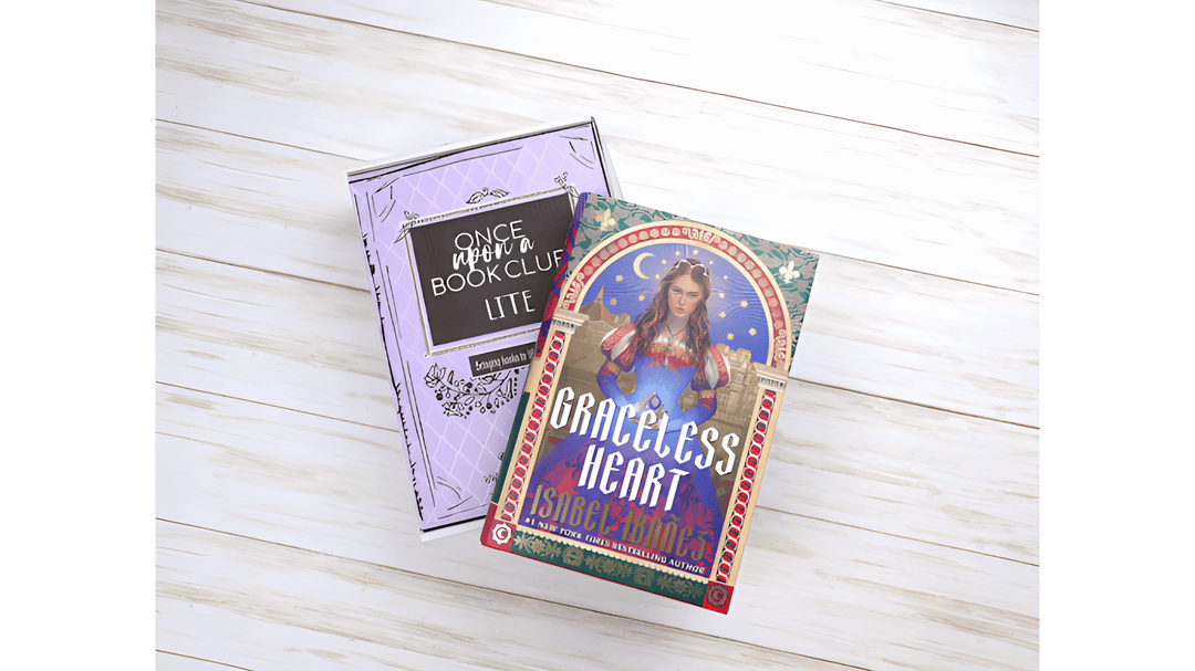 Once Upon a Book Club Lite box styled beside Graceless Heart by Isabel Ibañez on a light wooden background.