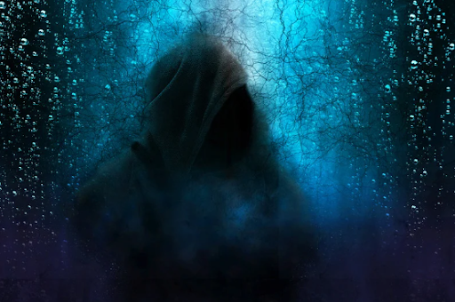 Silhouette of a hooded figure in a dark, misty forest with a blue and purple background, evoking a mysterious and eerie atmosphere.