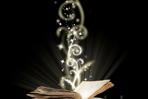 An open book with glowing, magical light and stars emanating from its pages against a dark background.