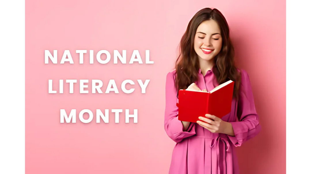 A smiling woman in a pink dress reading a red book against a matching pink background with the text "National Literacy Month."