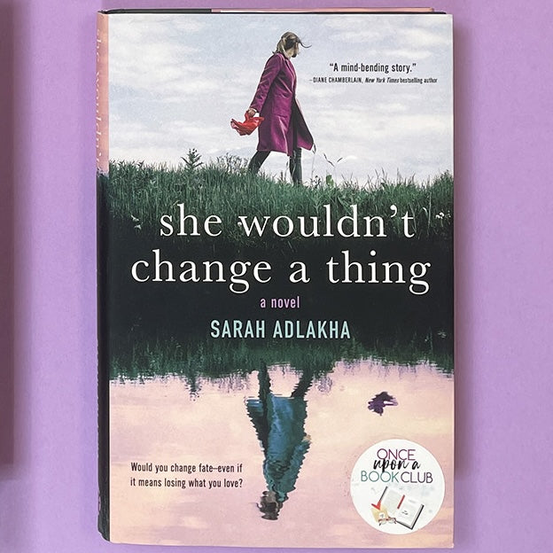 A hardcover copy of She Wouldn't Change a Thing by Sarah Adlakha.