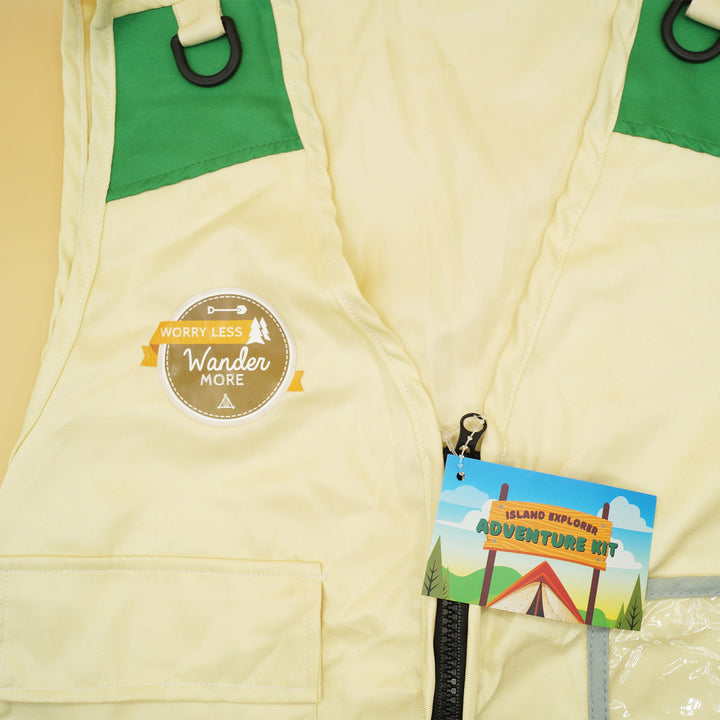 a tan vest that says "Worry Less, Wander More" along with a tag labeled "Island Explorer Adventure Kit"