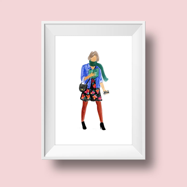 An illustration of a woman with a medium skin tone and ash-blonde hair to her ears. She wears a green scarf, a blue denim jacket, a floral knee-length dress, red tights, and black heeled booties. She carries a cell phone in one hand, has a black crossbody bag slung over her shoulder, and is holding a green book open as she reads and walks.