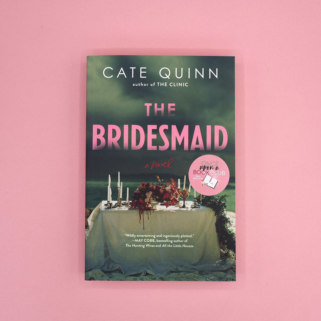 Book cover of 'The Bridesmaid' by Cate Quinn on a pink background