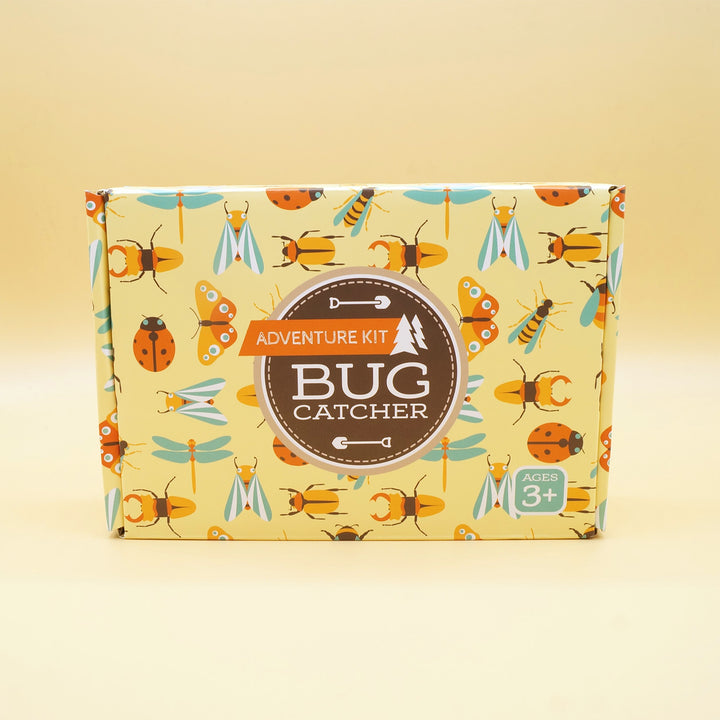 a box with a pattern of bugs on it labeled "Adventure Kit Bug Catcher" sits on a yellow background
