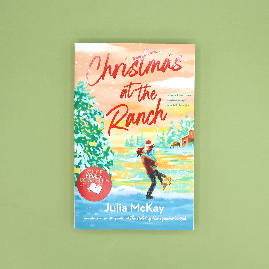 Book cover of 'Christmas at the Ranch' by Julia McKay on a green background