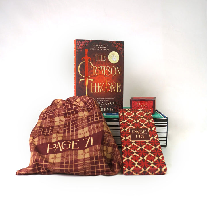 A hardcover copy of The Crimson Throne by Sara Raash & Beth Revis surrounded by wrapped gifts labeled with page numbers.