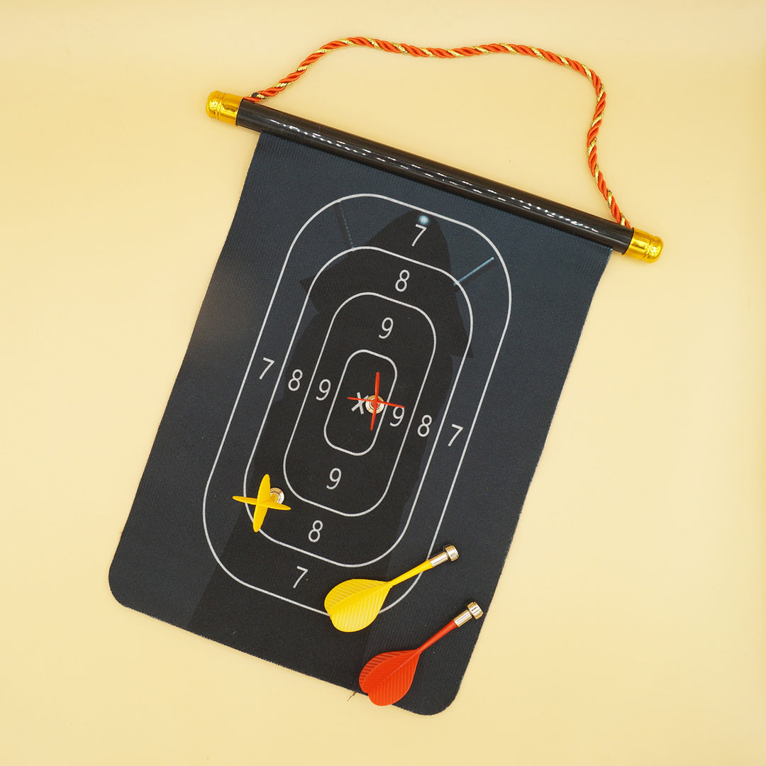 a black dartboard with two yellow darts and two red darts. a silhouette of a person is behind the scoring oval