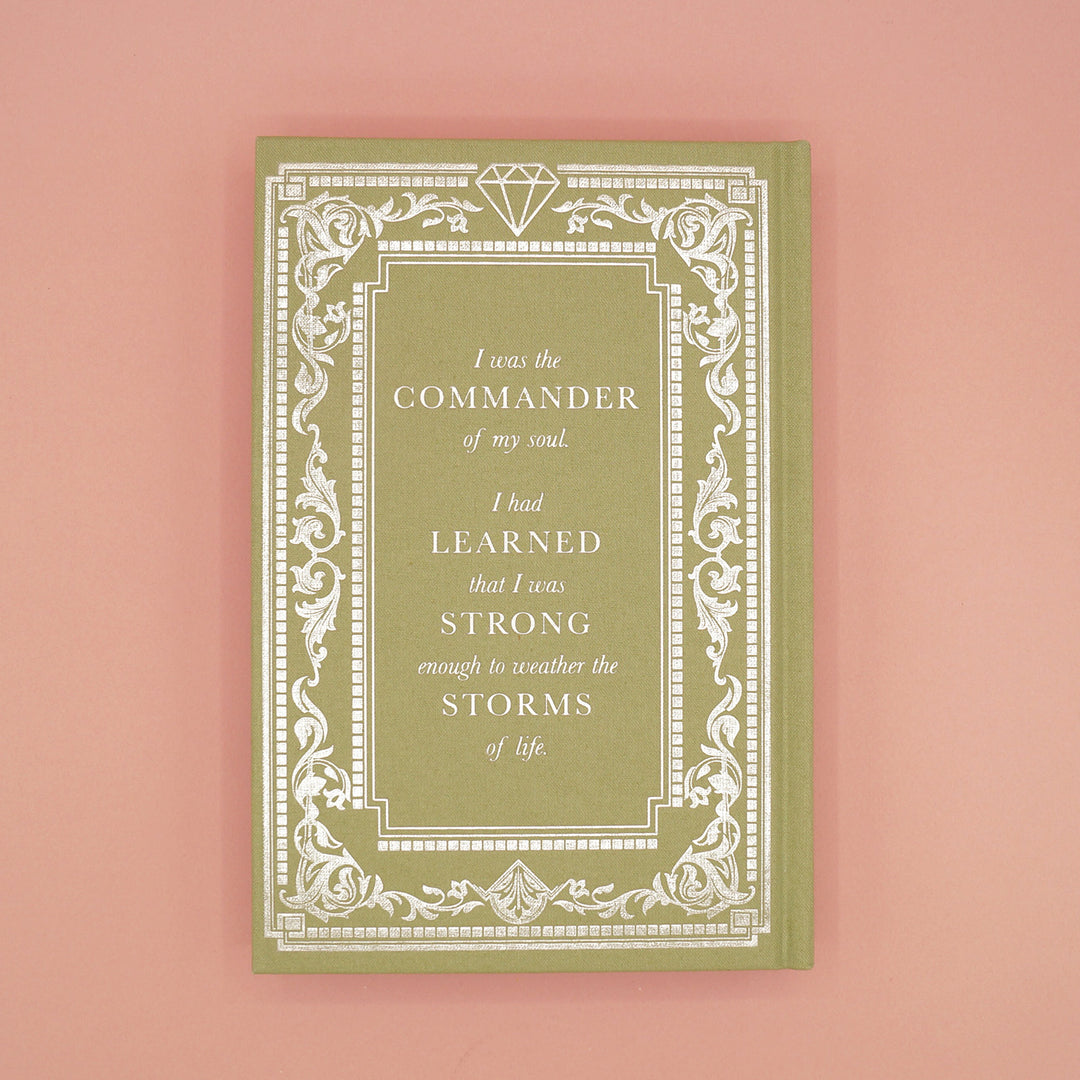The back of the custom, exclusive edition of The Diamond of London by Andrea Penrose designed by Once Upon a Book Club. The hard case is a light green with silver foiling in a classic style. The quote on the back reads "I was the commander of my soul. I had learned I was strong enough to weather the storms of life."