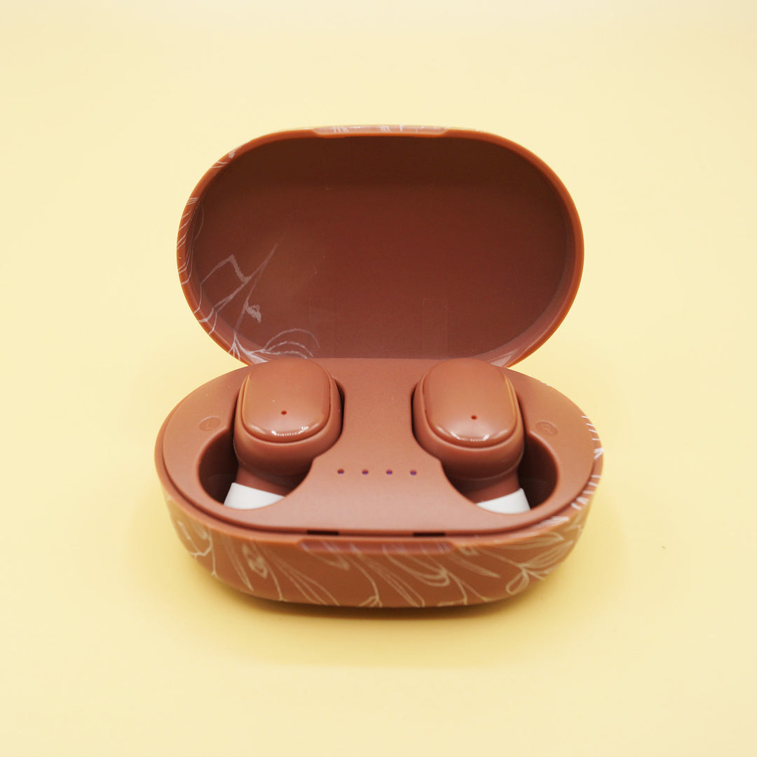 an open brown case of wireless earbuds