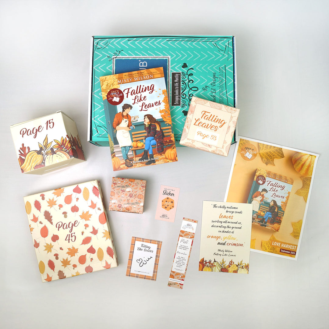 A copy of Falling Like Leaves by Misty Wilson is surrounded by paper items and wrapped gifts labeled with page numbers featuring an autumn theme on a light gray background
