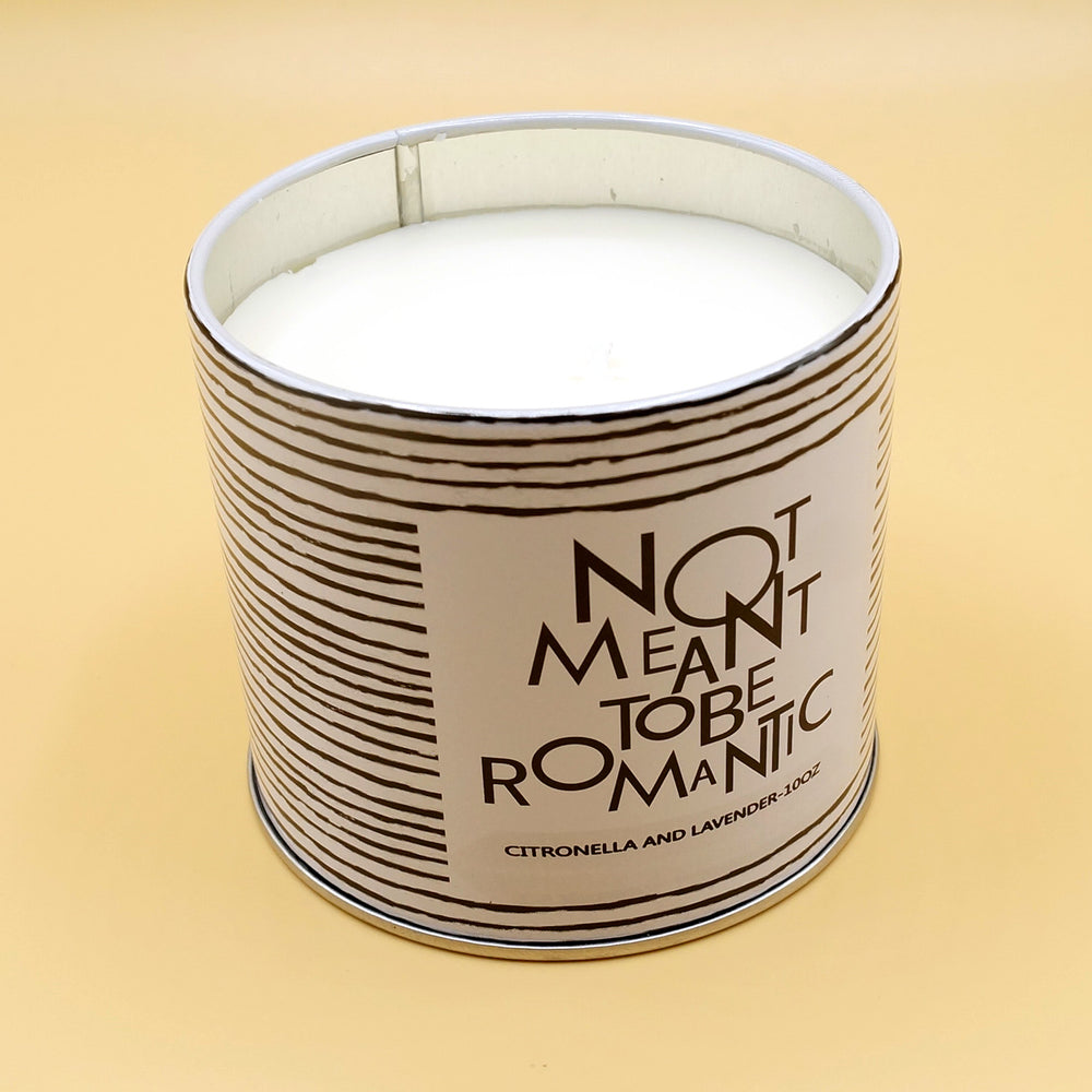 a black and white striped candle with the label Not Meant to be Romantic - citronella and lavender - 10oz