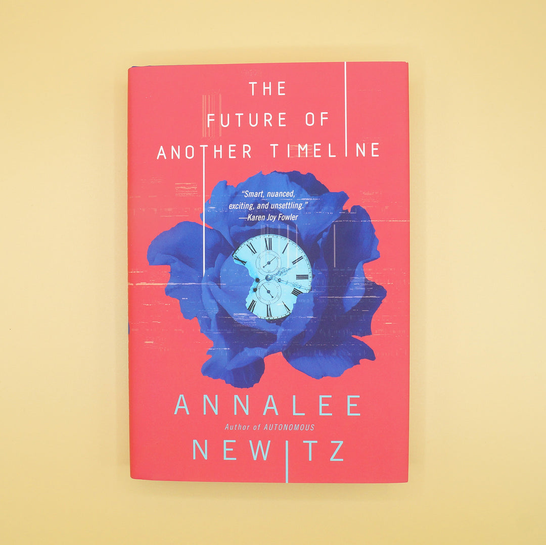 a hardcover copy of The Future of Another Timeline against a yellow background