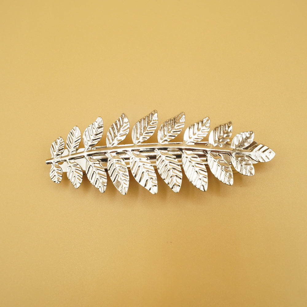 A silver leaf hair clip.