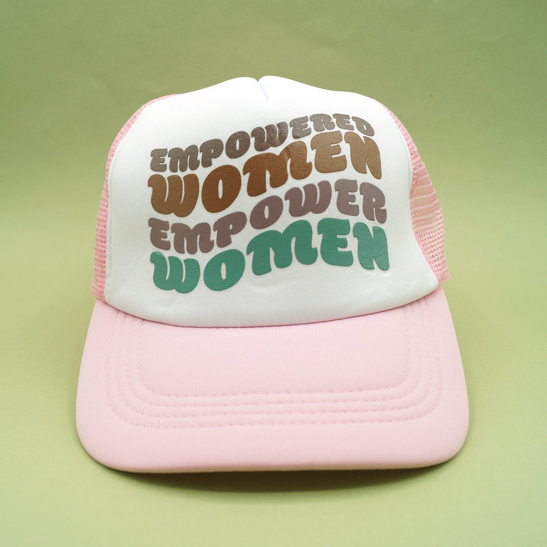 a pink snapback trucker hat that says "empowered women empower women" on the front