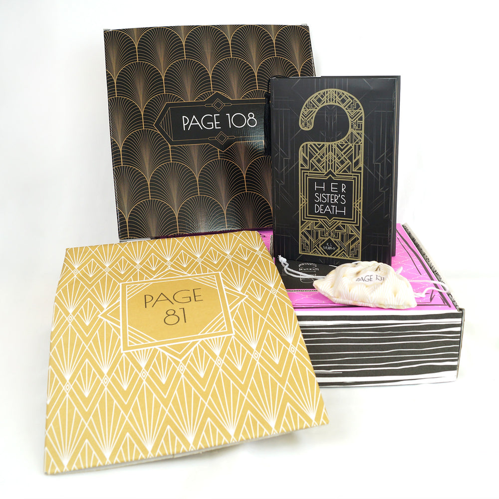 A hardcover special edition of Her Sister's Death, a black and gold box, and a white drawstring bag are on a pink Once Upon a Book Club box. A gold folder leans against the pink box. The boxes and folder all have page numbers.