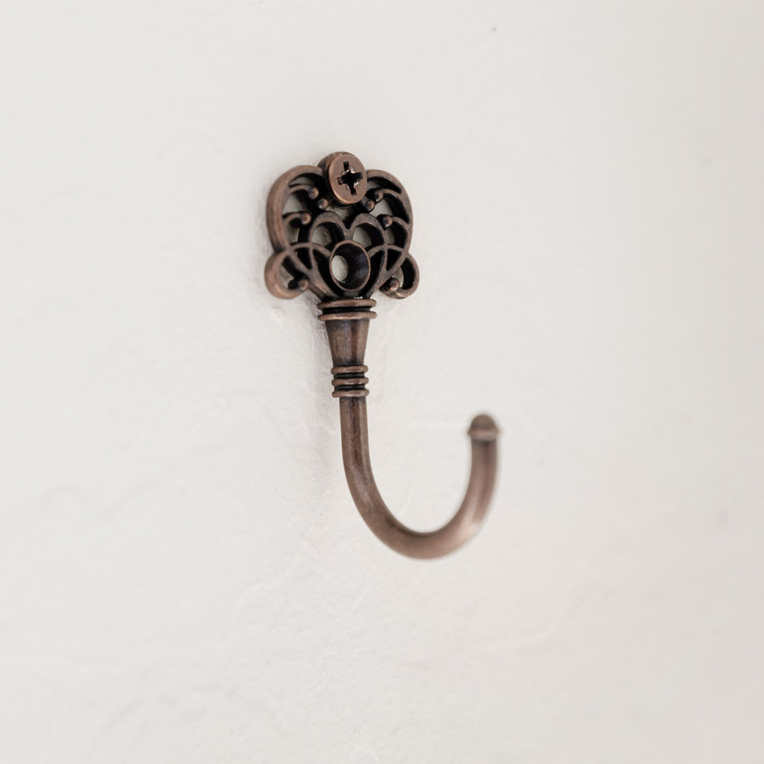 a key wall hook nailed into the wall