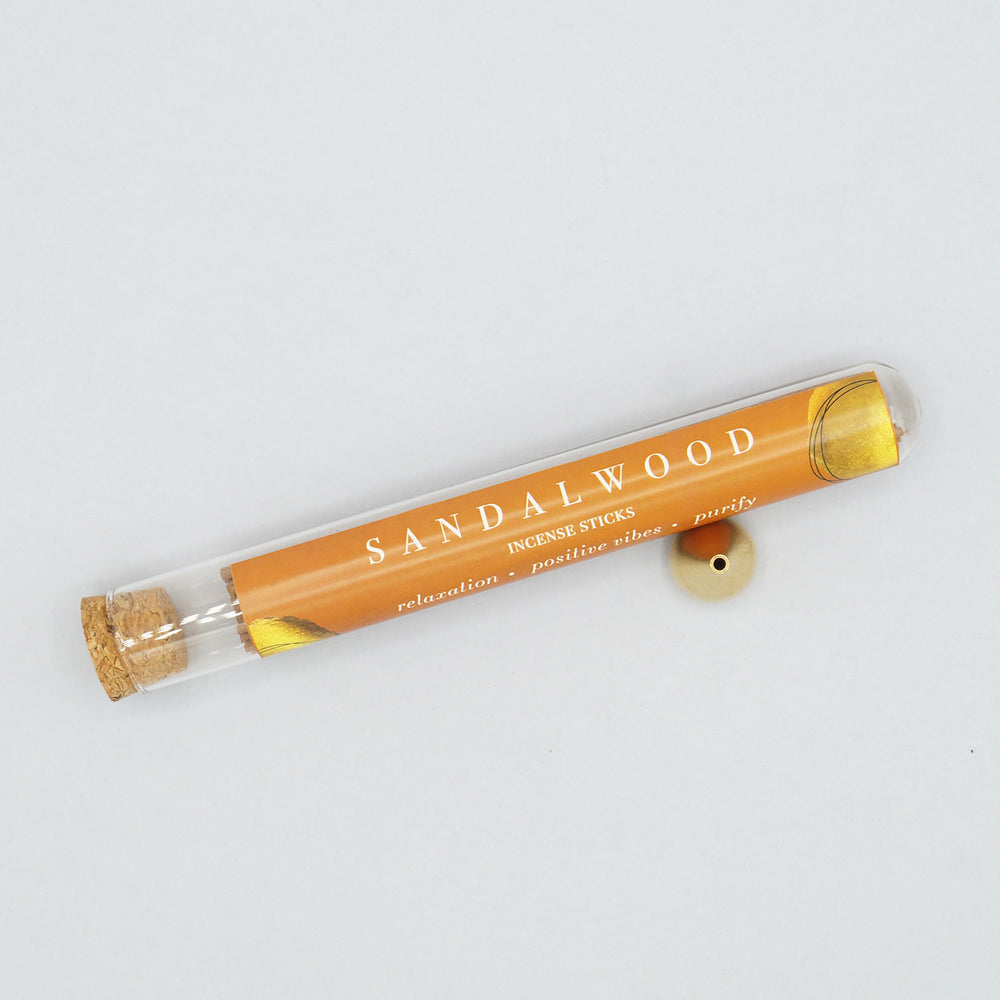 a tube of sandalwood incense sticks