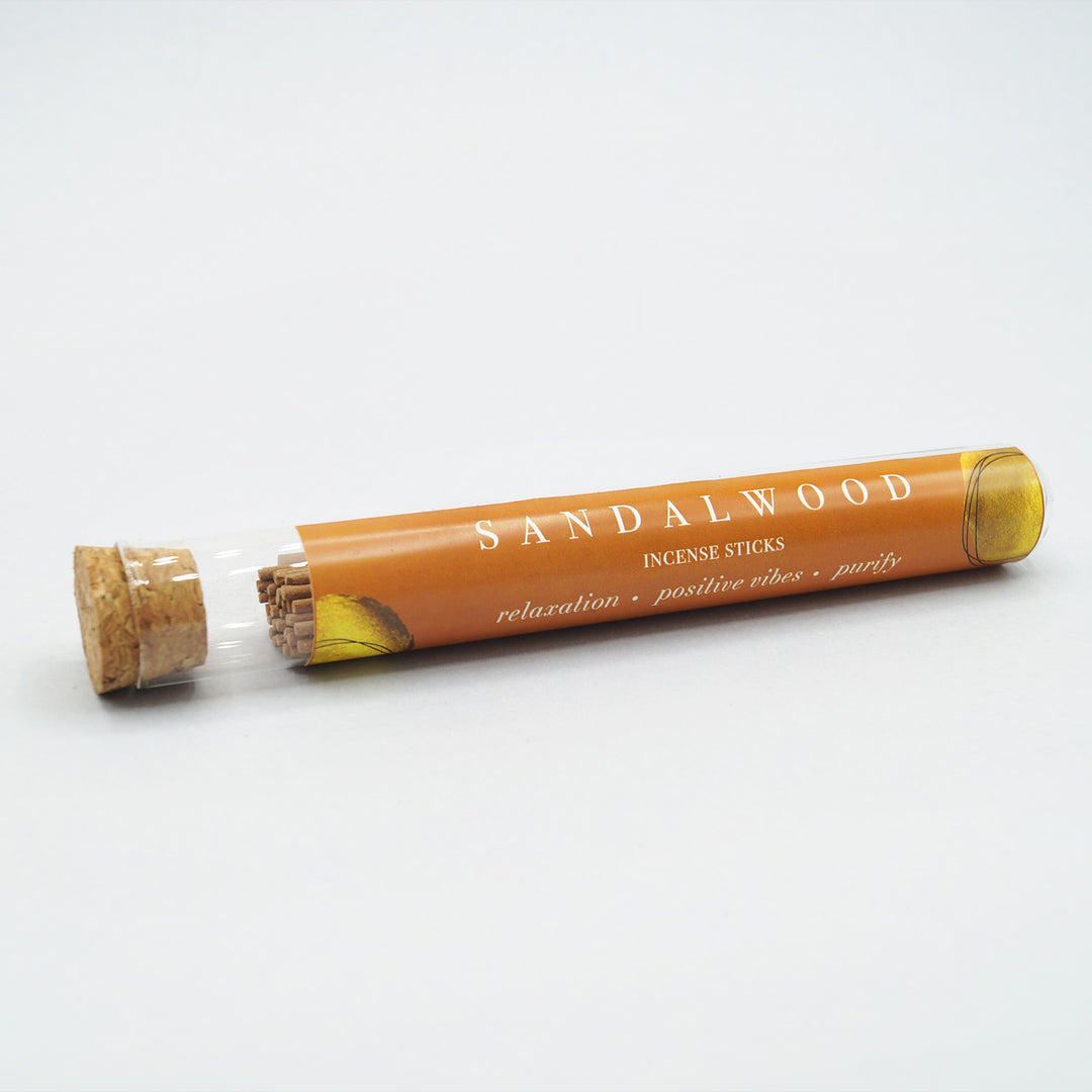 a tube of sandalwood incense sticks