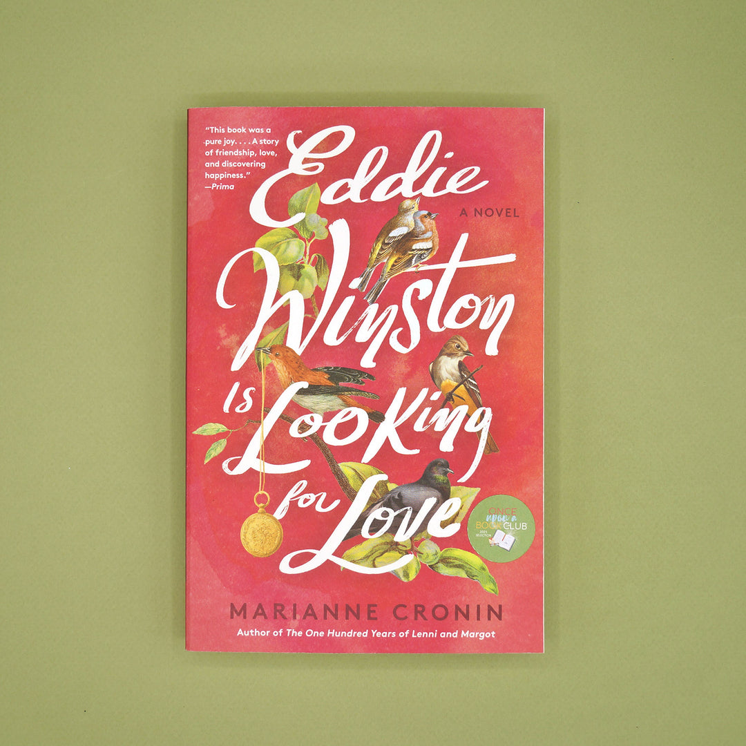A new paperback copy of Eddie Winston is Looking for Love by Marianne Cronin on a green background.