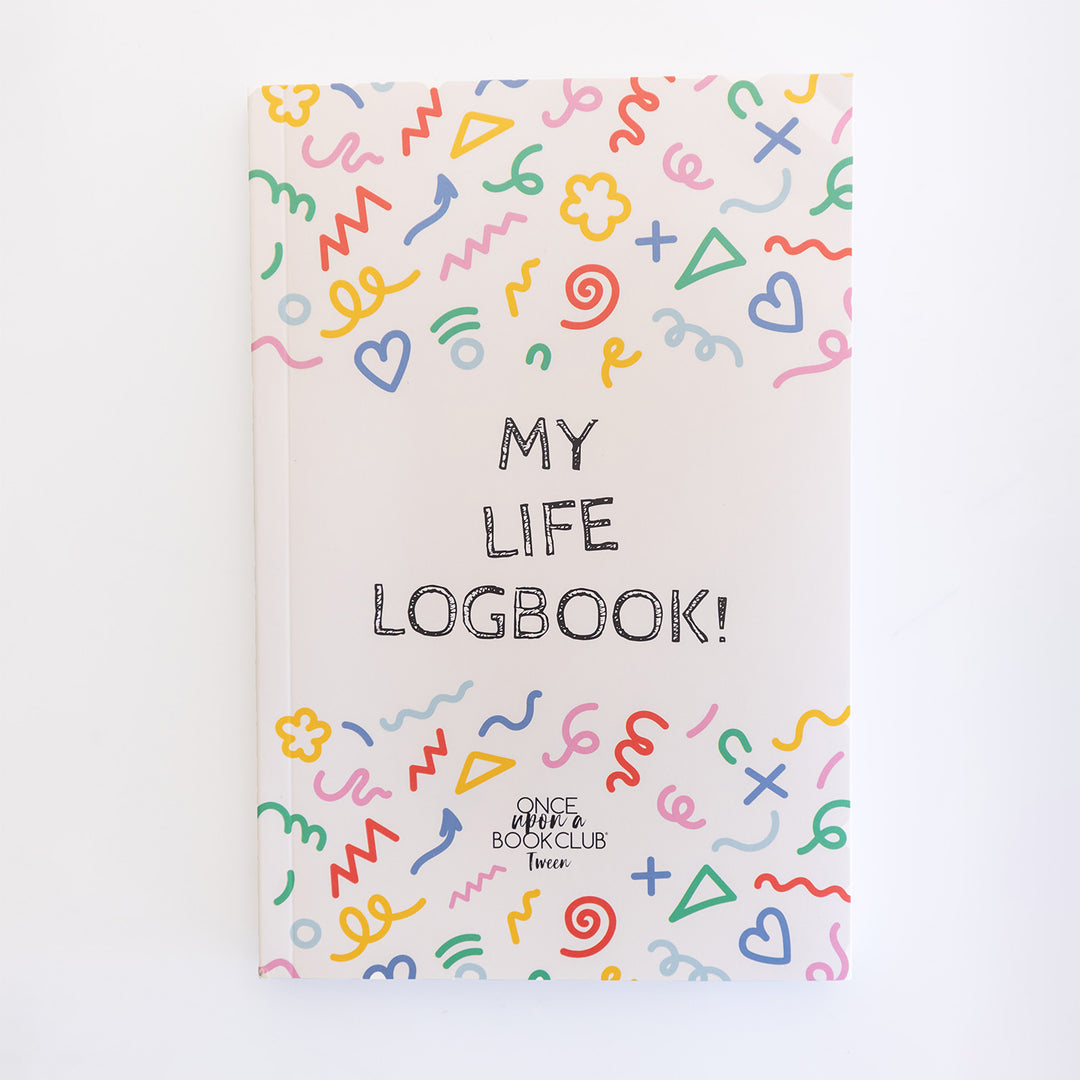 A white journal with colorful squiggles on the top and bottom of the cover. The middle says My Life Logbook! OUABC Tween.