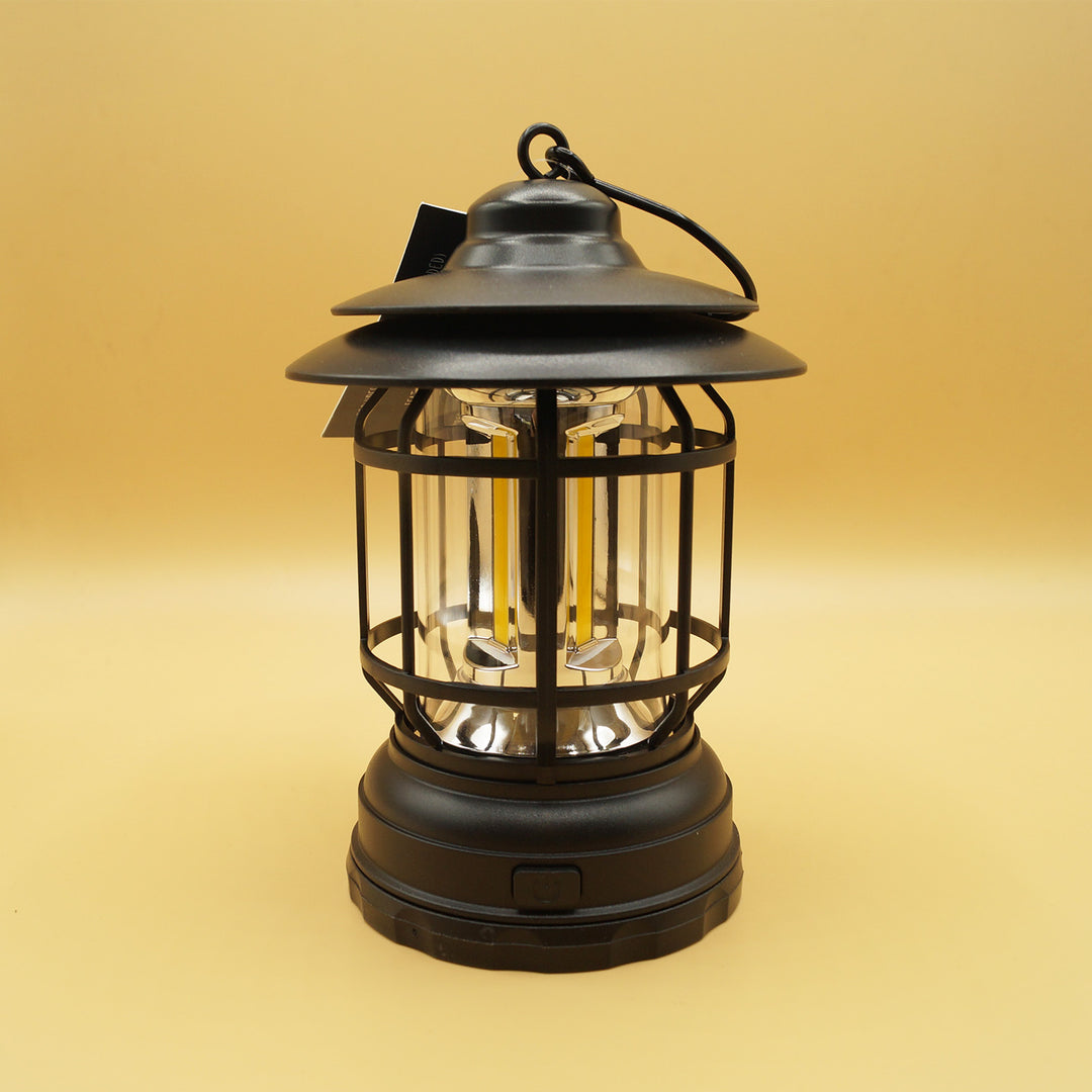 a black hanging lantern sits on a yellow background