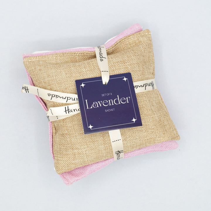 a stack of 3 lavender sachets in tan, pink, and white (one color each)