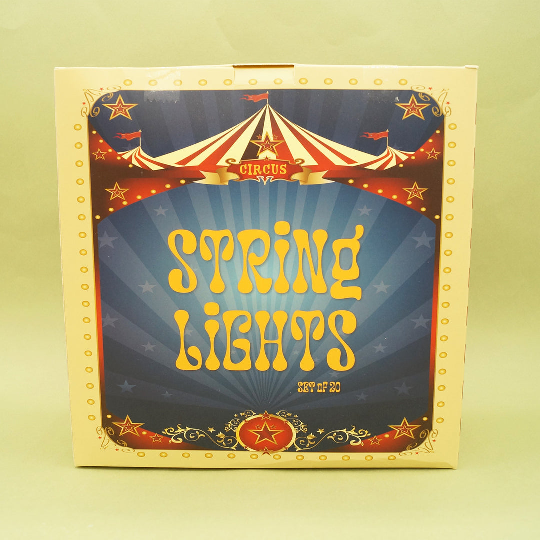 Box of string lights with circus-themed design on a yellow background