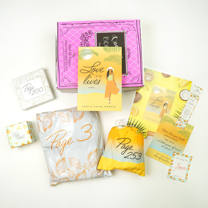 A hardcover copy of Love of My Lives sits on a pink box. In front of the box (from left to right) are a small box with oranges on it, a box with palm fronds on it, a white bag, a yellow/orange drawstring bag, bookclub kit, quote card, bookmark, and signature card. The boxes and bags all have page numbers.