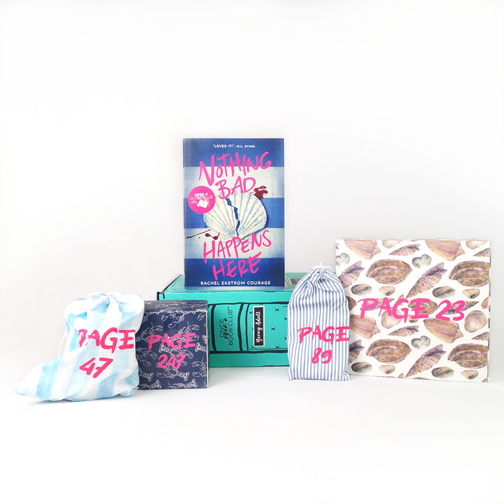 A paperback edition of Nothing Bad Happens Here stands on a green OUABC box. In front of the box are four themed wrapped gifts that match the book cover labeled with page numbers.