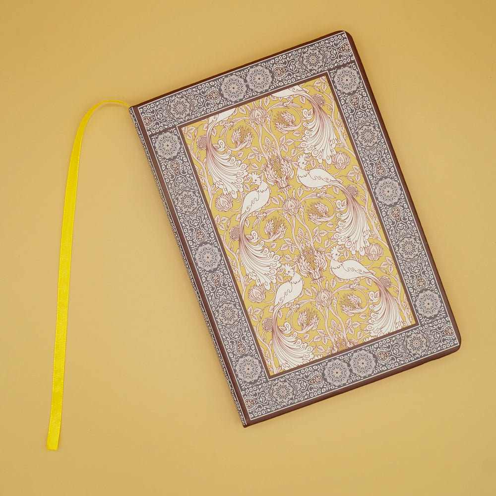 a brown rubaiyat journal with a yellow page marker